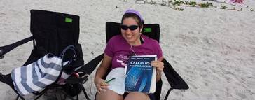 Anderson spends some time on calculus while relaxing on the beach.  