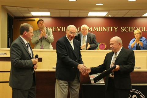 Retired auto teacher Paul Tregembo Sr. received recognition from superintendent John Kment.