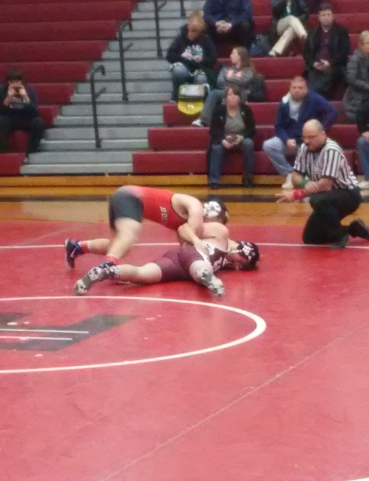 Senior Kyle Minor works his way into pinning his oppenent