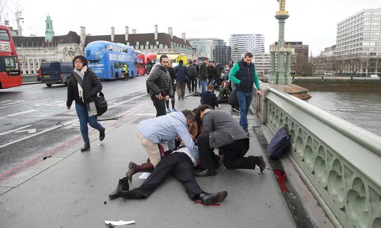 People care for the injured after the car drove through Westminster bridge.