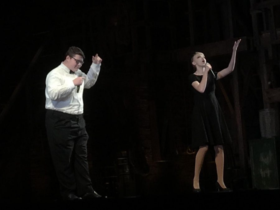 Seniors Cody Quiroz and Kaelyn Kowalski, one of 14 EduHam performances, rap a  Hamilton-inspired song about the Whiskey Rebellion at the Fisher Theatre.