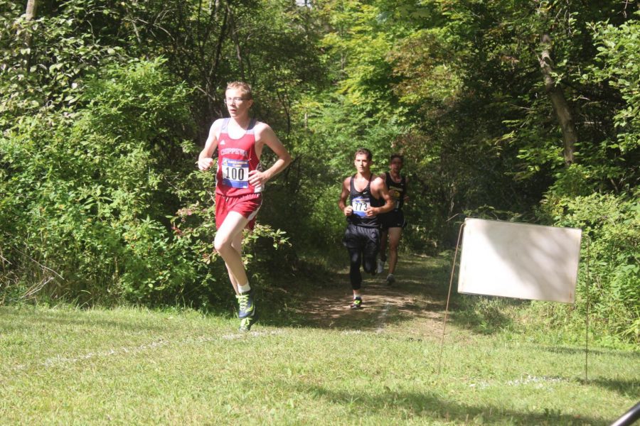 Junior Cameron Newman strides to keep up with Chippewa Valley in varsity race. 