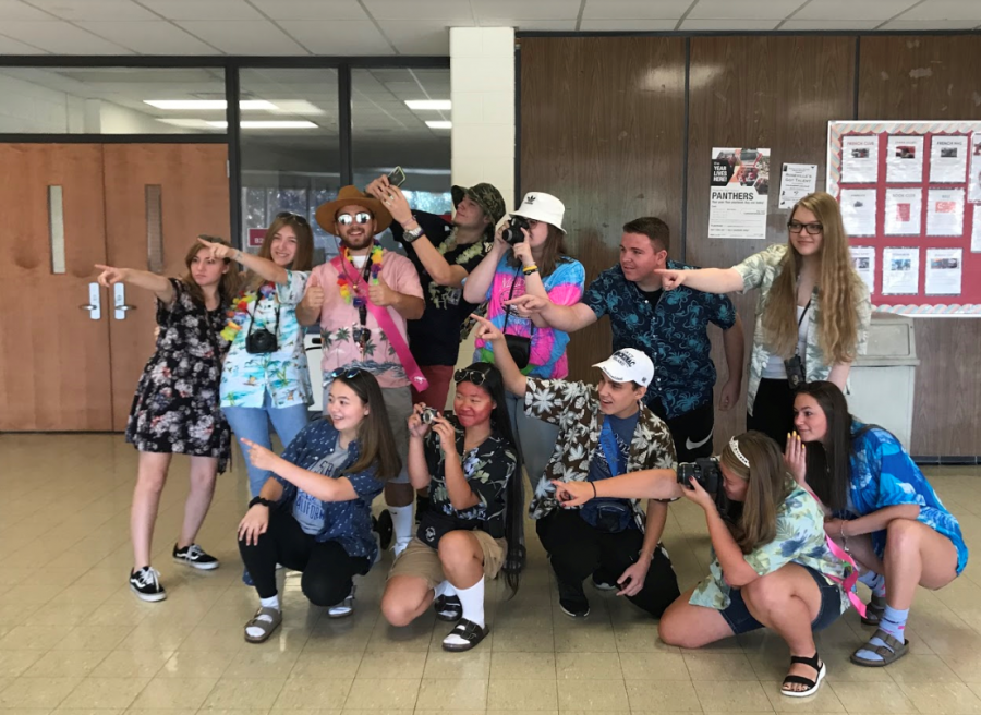 Seniors participating in tacky tourist Tuesday by posing with their tour group.