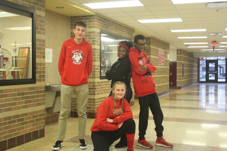 Juniors Lucas Horsley, Janai Carter, Camillia Matyszewski and senior Caleb Douglas show their spirit by wearing red.