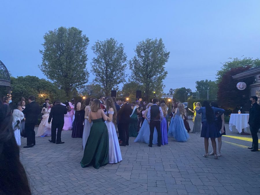 Seniors gather as the dance was held in the outside area of the Vintage House.